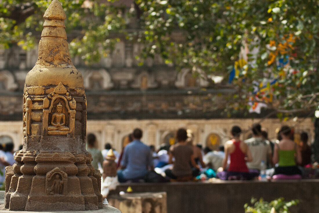 'India, Bihar, Buddhist Mediators Outside Mahabodhi Temple With Small Stupa On Left; Bodhgaya'