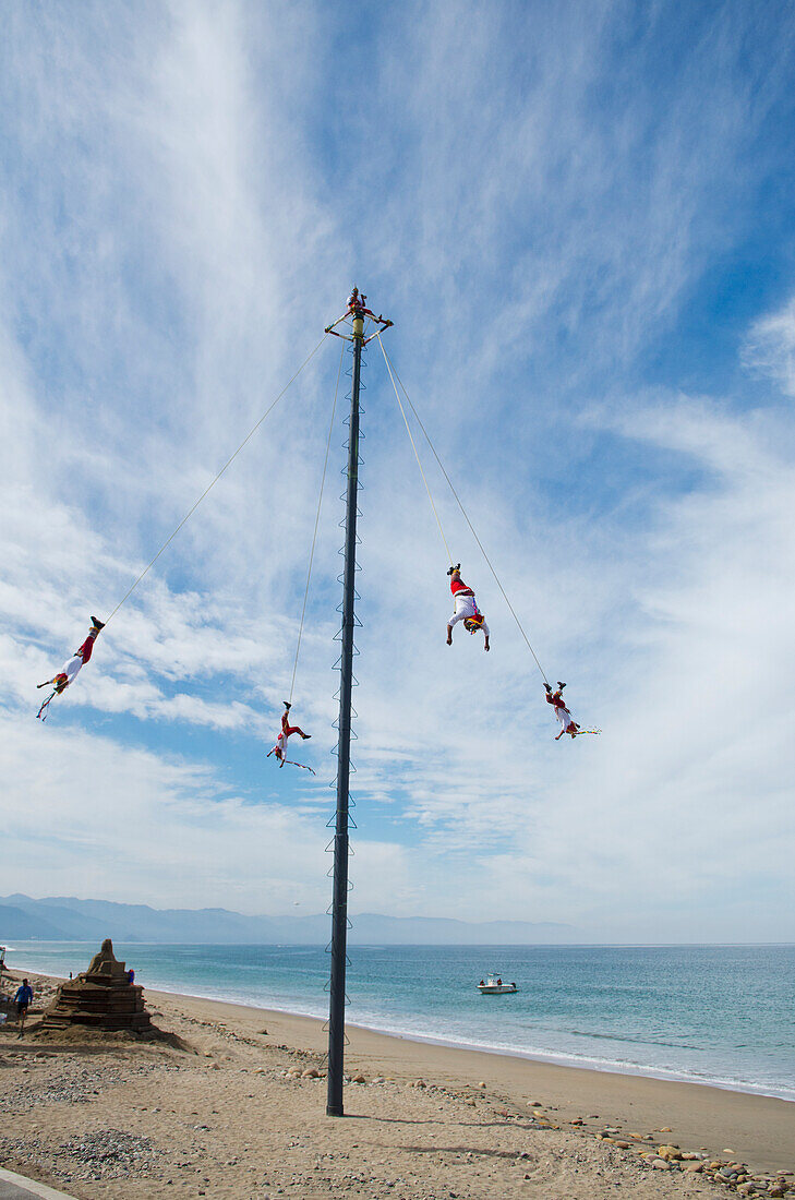 'Mexico, Jalisco, Acrobats Performing On Beach; Puerta Vallarta'