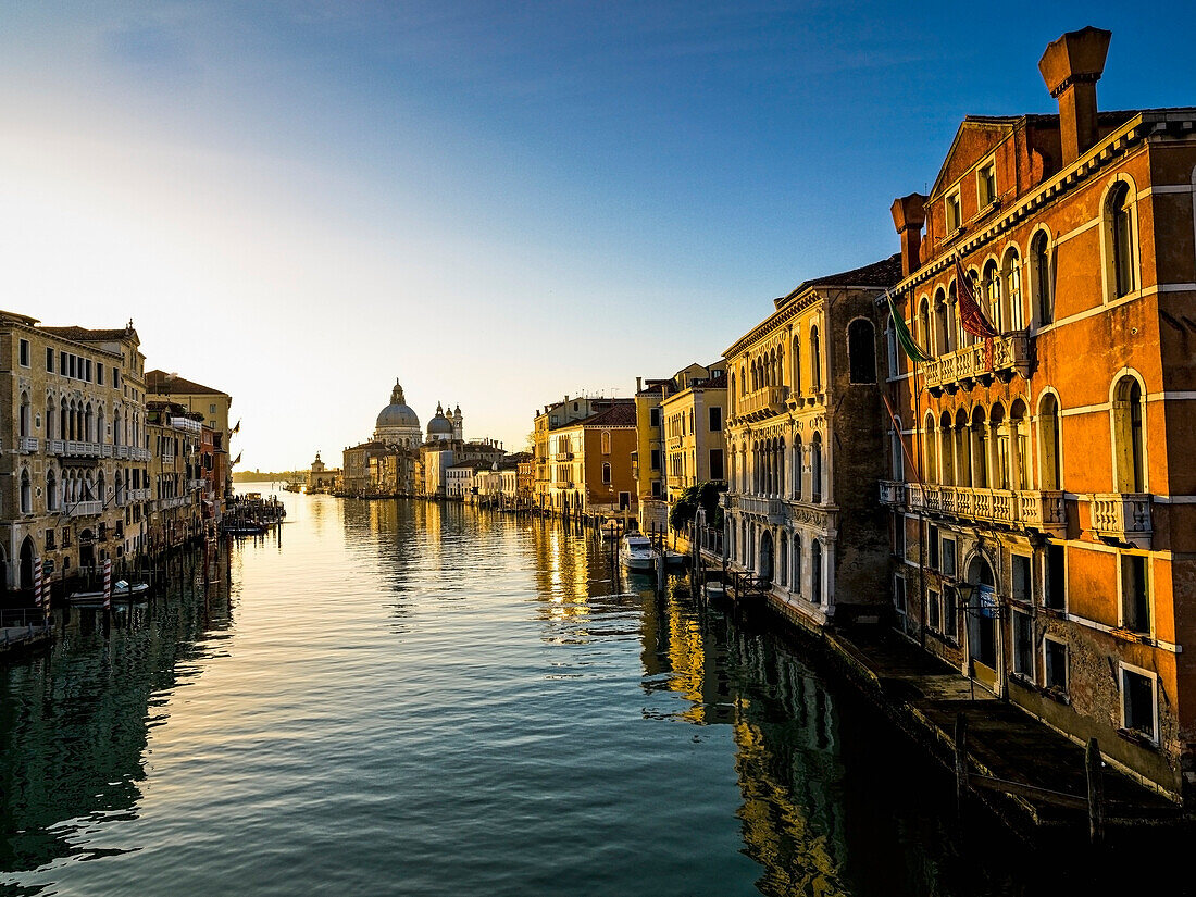 'Italy, Buildings Along Canal At Sunset; Venice'