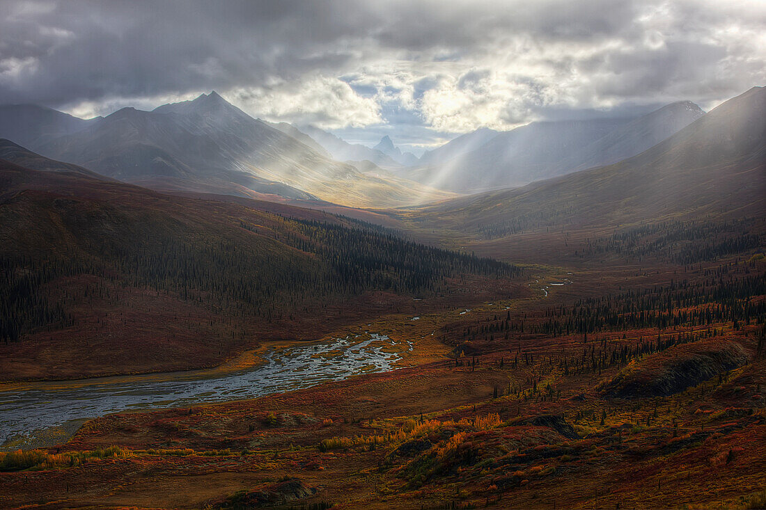 'Shafts Of Light Burst Through The Storm Clouds In Klondike Valley Of Tombstone Territorial Park;Yukon Canada'
