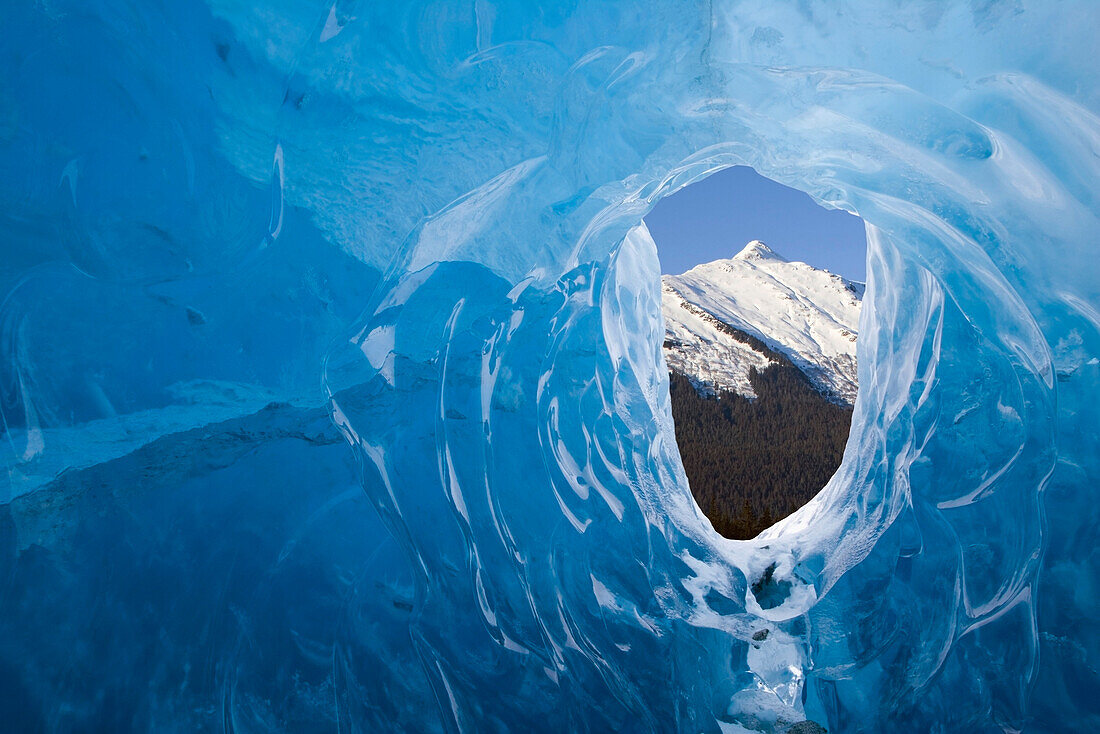 Male ice climber inside ice cave Mendenhall Glacier Tongass National Forest Southeast Alaska Spring