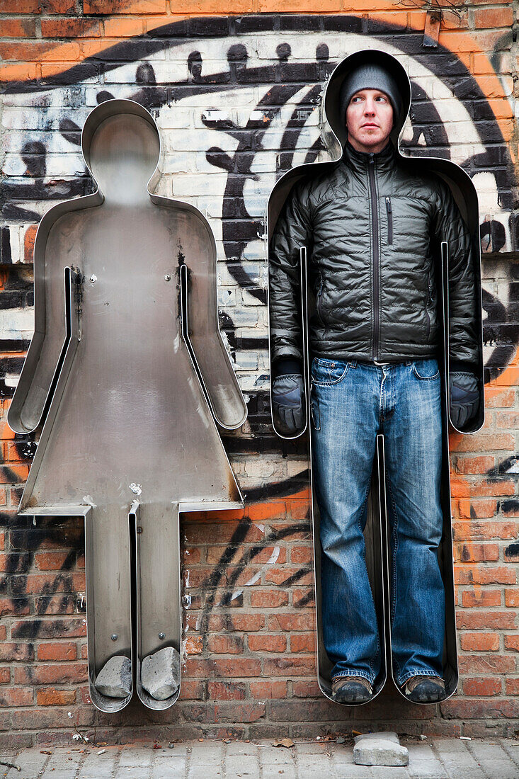 'China, Cookie Cutter Man Looking At Empty Cookie Cutter Woman; Beijing'