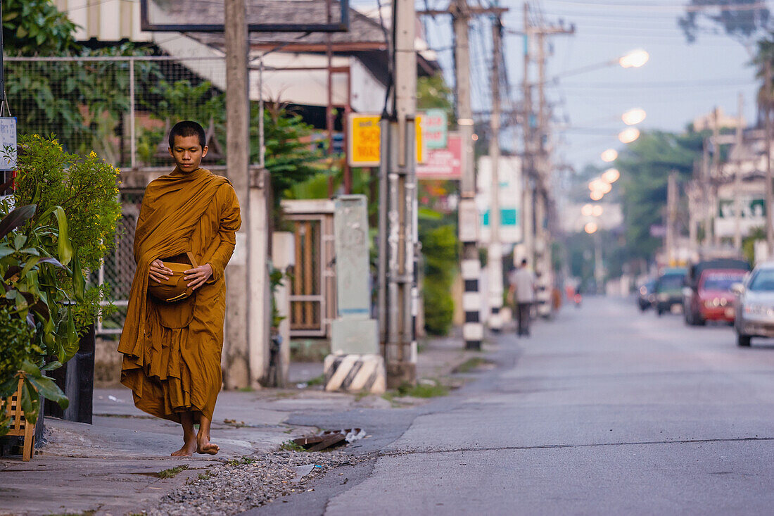 'Thailand, Monk Walking Down Street; Chiang Mai'