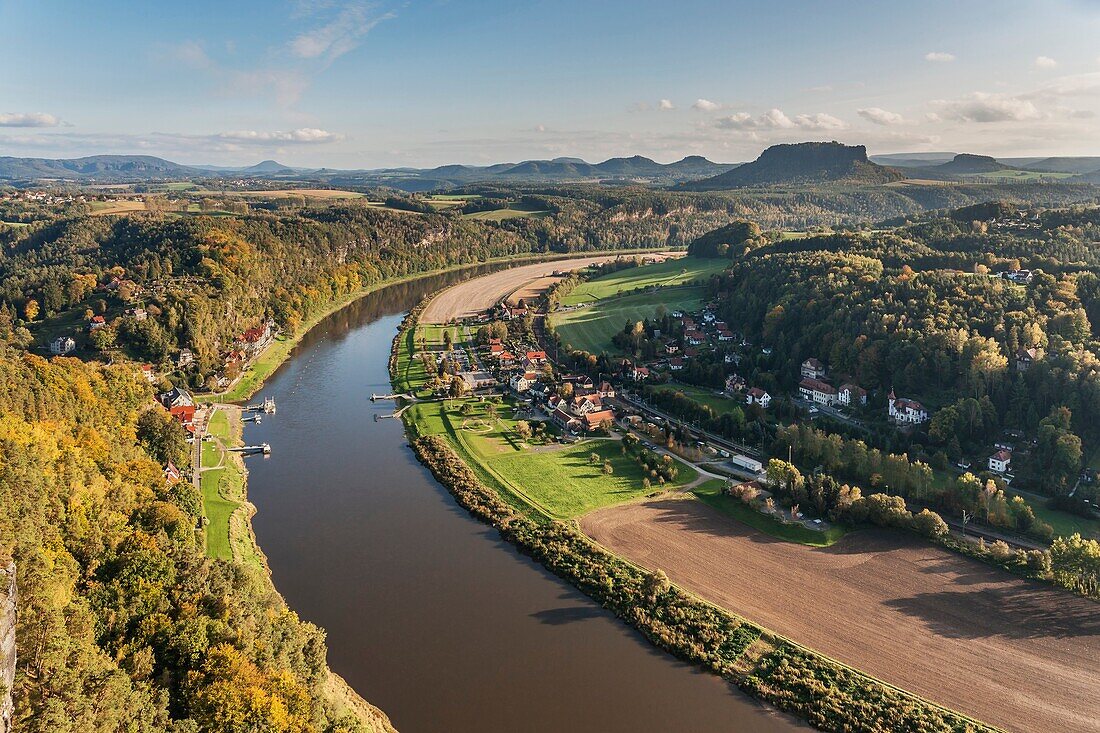 View from the spectacular rock formation Bastei (Bastion) in the national park Saxony Switzerland to the health resort Rathen near Dresden and to Elbe River. In the background is the Table Mountain Lilienstein. He is one of the most striking mountains in 