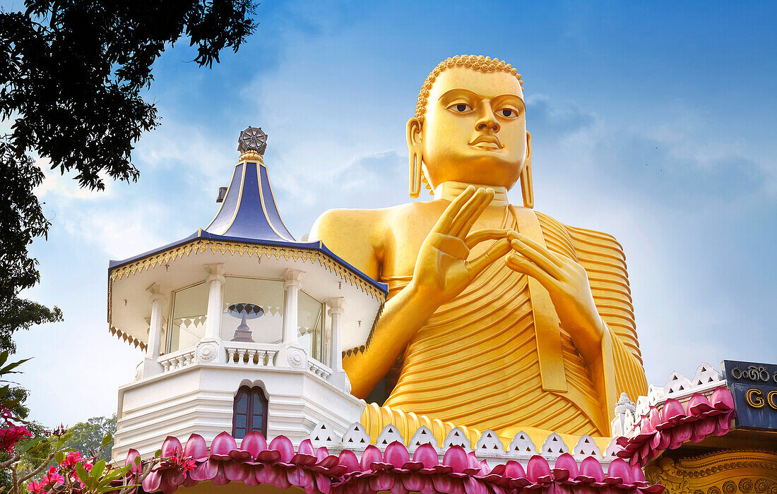 Sri Lanka - Dambulla, Golden Buddha statue over the Buddish Museum, Kandy province, UNESCO World Heritage Site, central region of Sri Lanka Island