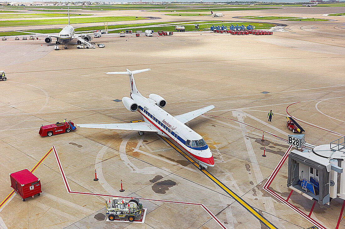 A docked American Airlines plane parked on the tarmac