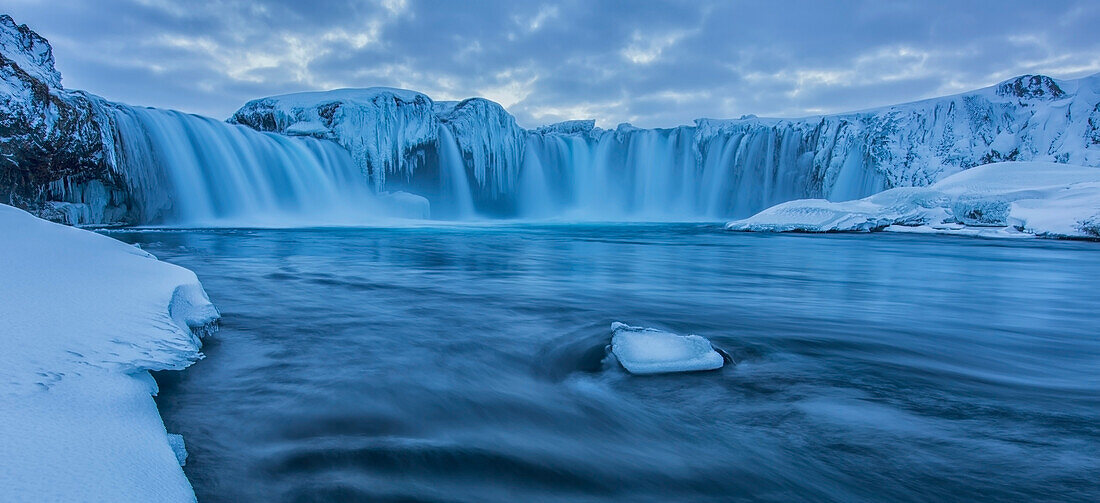 The waterfall Godafoss in northern Iceland seen in the winter at sunset, Iceland