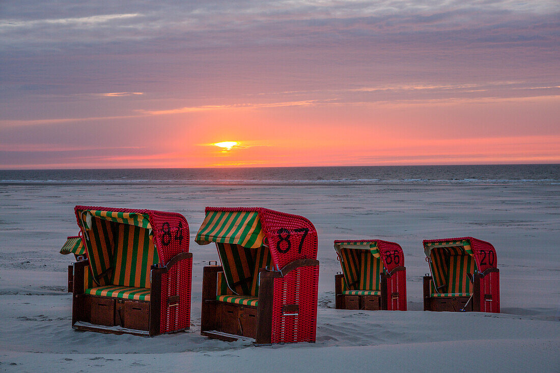 Beach and beach chairs at sunset, Juist Island, Nationalpark, North Sea, East Frisian Islands, East Frisia, Lower Saxony, Germany, Europe