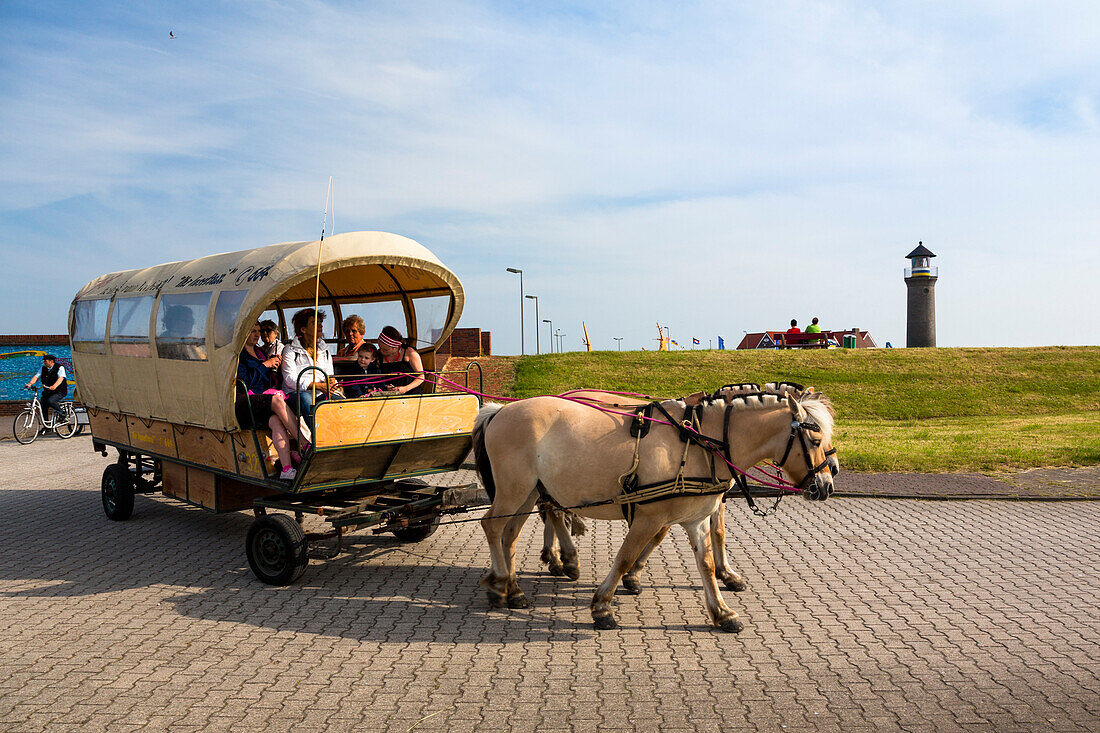 Horse and cart near a lighthouse, Juist Island, Nationalpark, North Sea, East Frisian Islands, East Frisia, Lower Saxony, Germany, Europe