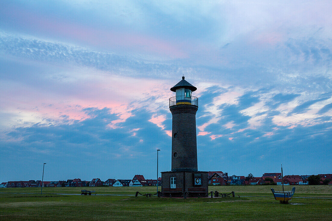 Colourful clouds over the lighthouse at Juist harbour, Juist Island, Nationalpark, North Sea, East Frisian Islands, East Frisia, Lower Saxony, Germany, Europe