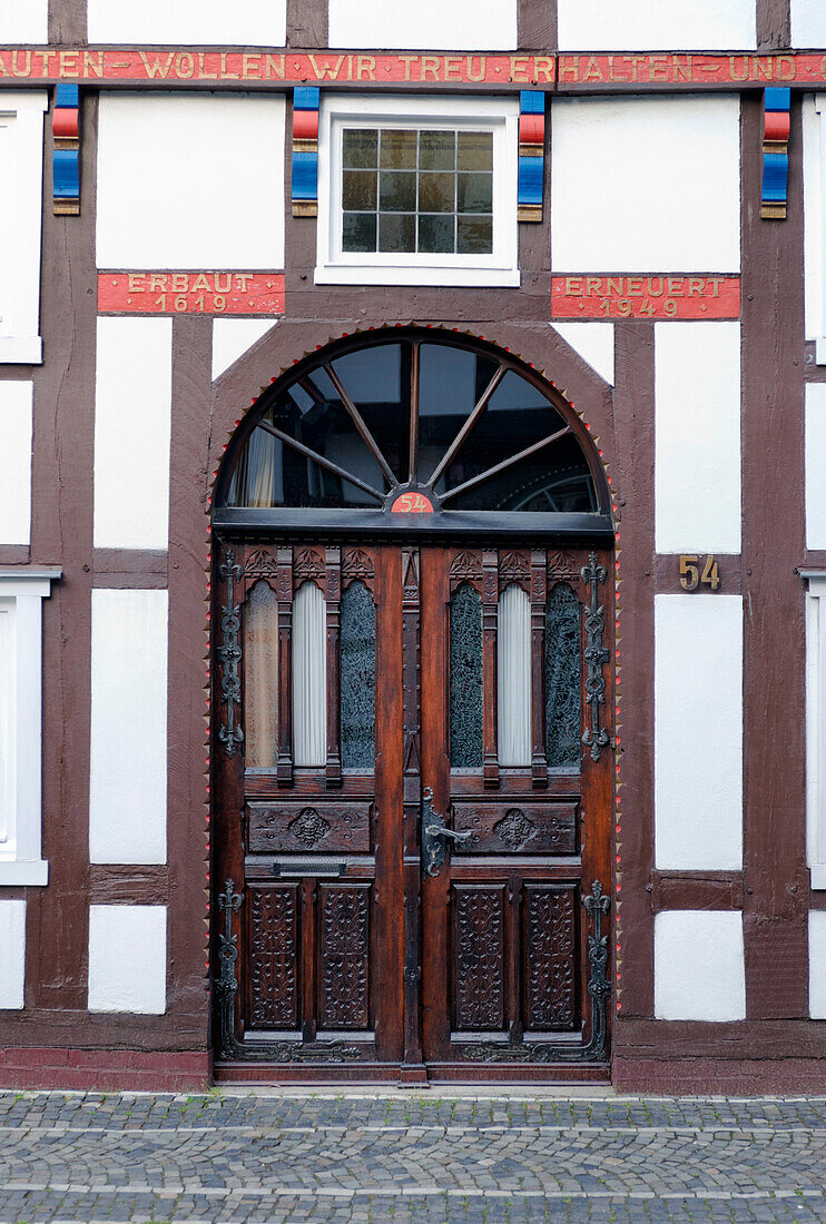 Entrance to a half-timbered house in Langenstrasse in Wiedenbrueck, Rheda-Wiedenbrueck, North Rhine-Westphalia, Germany