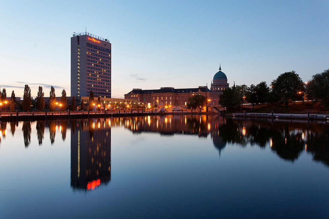 Pier of the ship company Weisse Flotte in the evening, Havel, with Hotel Mercure, Potsdam Palace and church of St. Nicholas in the background, Potsdam, Brandenburg, Germany