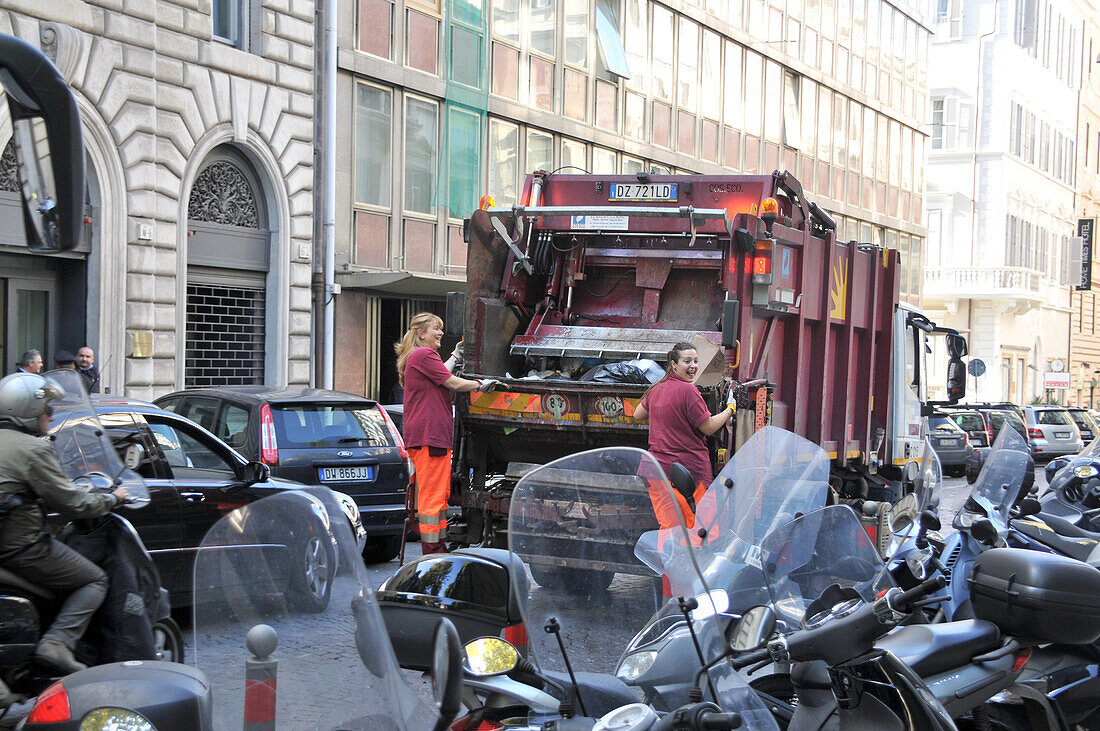 Garbage collectors in the streets of Rome, Italy