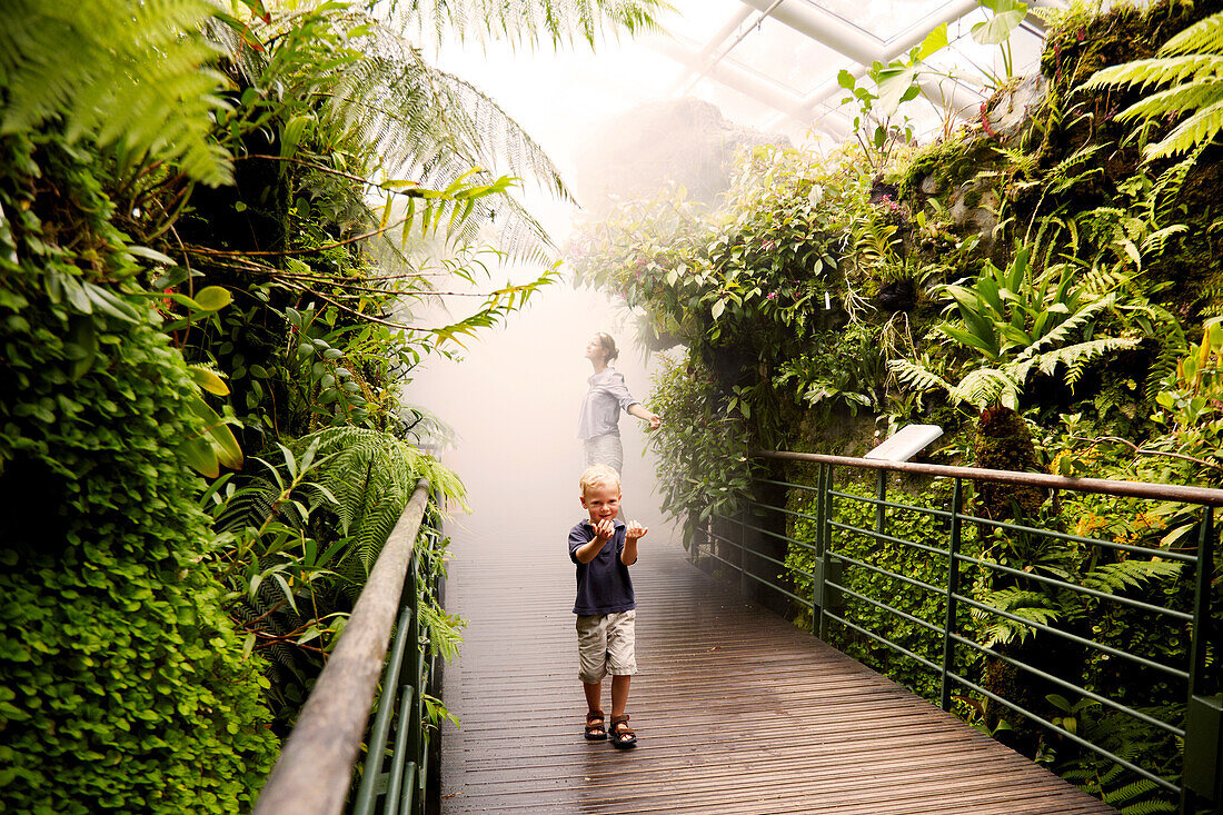 Mother and son inside a tropical greenhouse, Botanic Gardens, Singapore