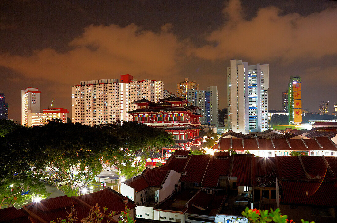 Buddha Tooth Relic Temple and Museum infront of skyline at night, Chinatown, Singapore