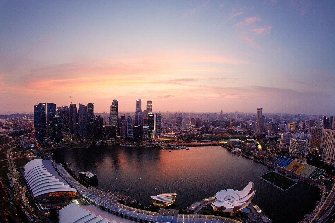 View over Marina Bay to skyline at night, Downtown core, Singapore