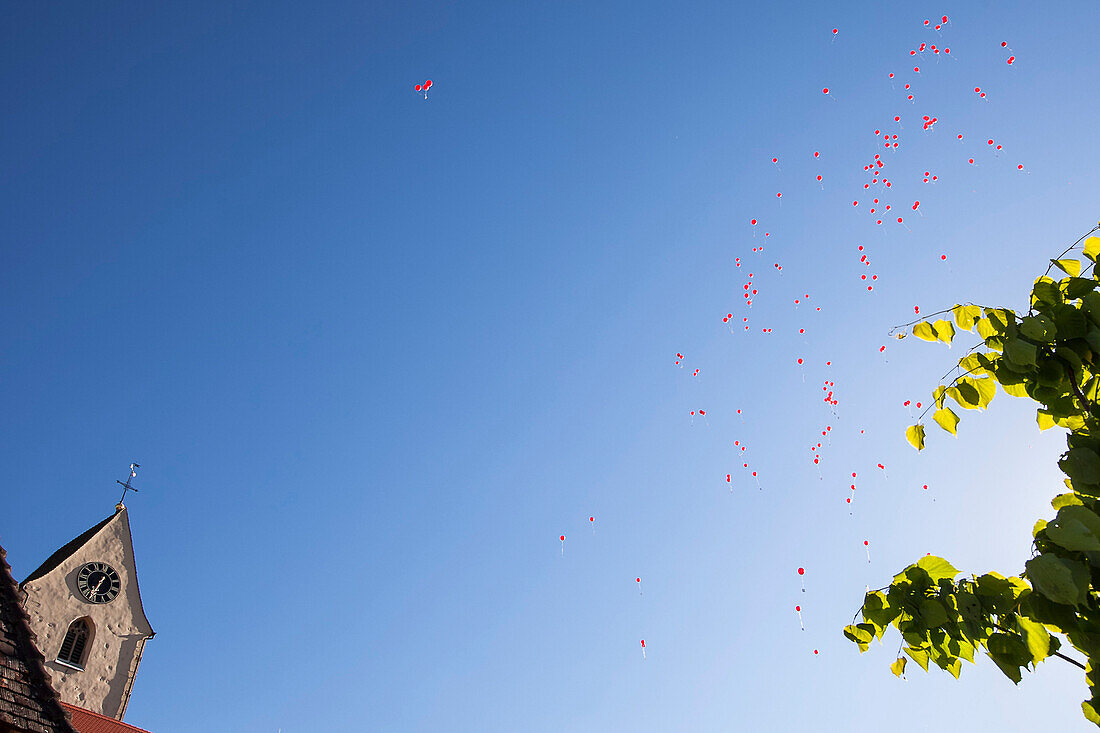 Red balloons against blue sky, Weiterdingen castle, Hilzingen, Baden-Wuerttemberg, Germany