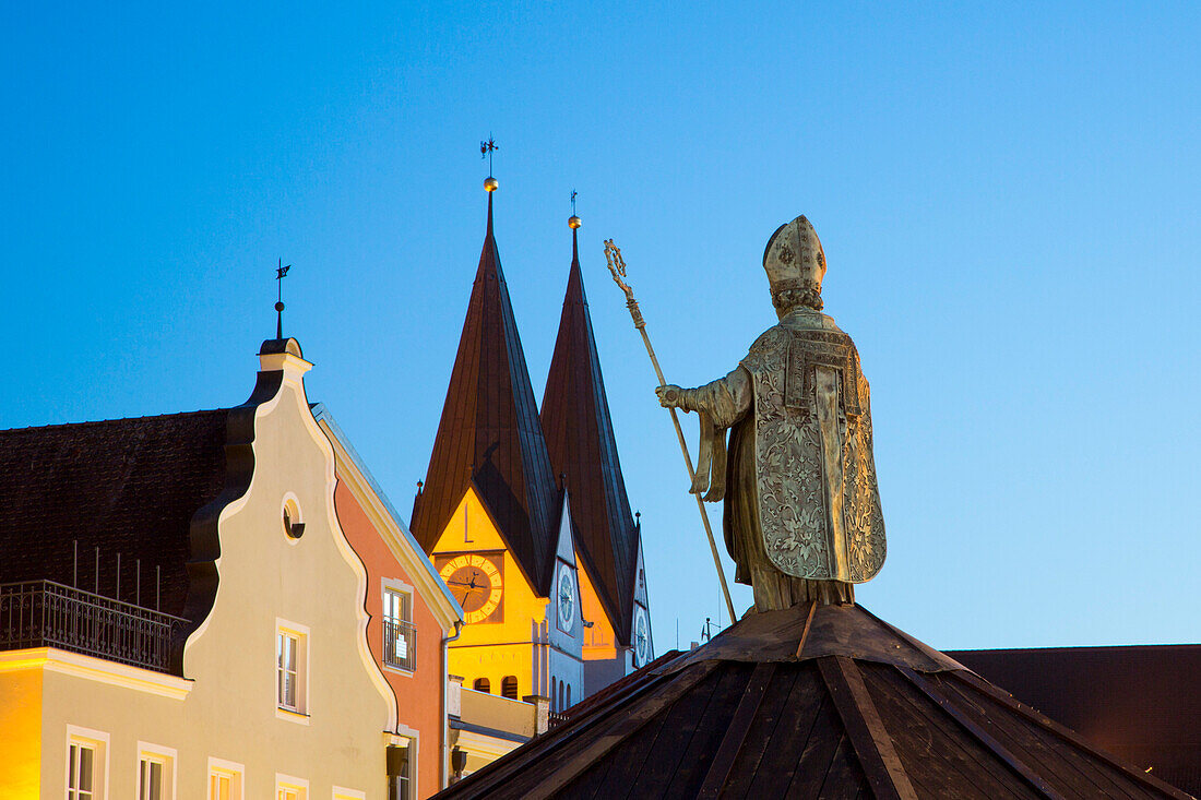 Bishop statue on Willibaldsbrunnen fountain on Marktplatz market square with church towers in the background, Eichstaett, Altmuehltal, Franconia, Bavaria, Germany