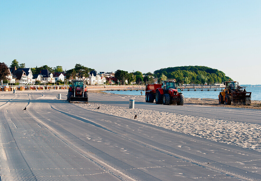 Tractors cleaning the beach, Travemuende, Luebeck, Schleswig-Holstein, Germany