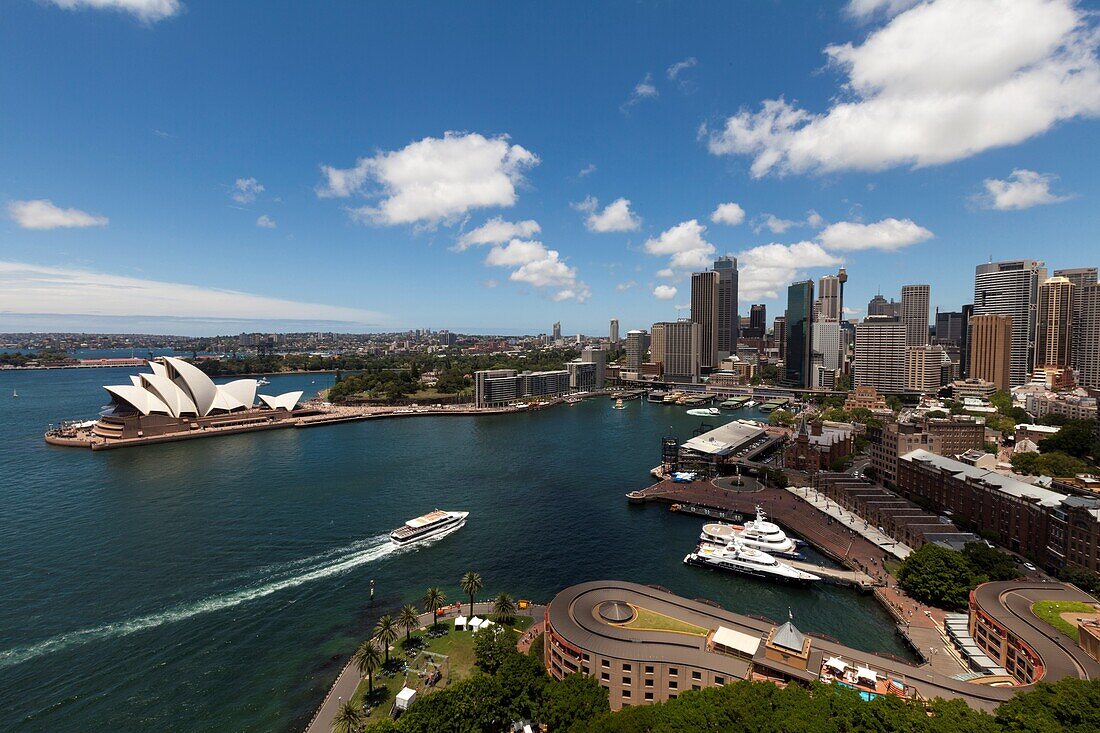 Australia, Sydney, Circular Quay business district in Sydney with ferry entering harbor