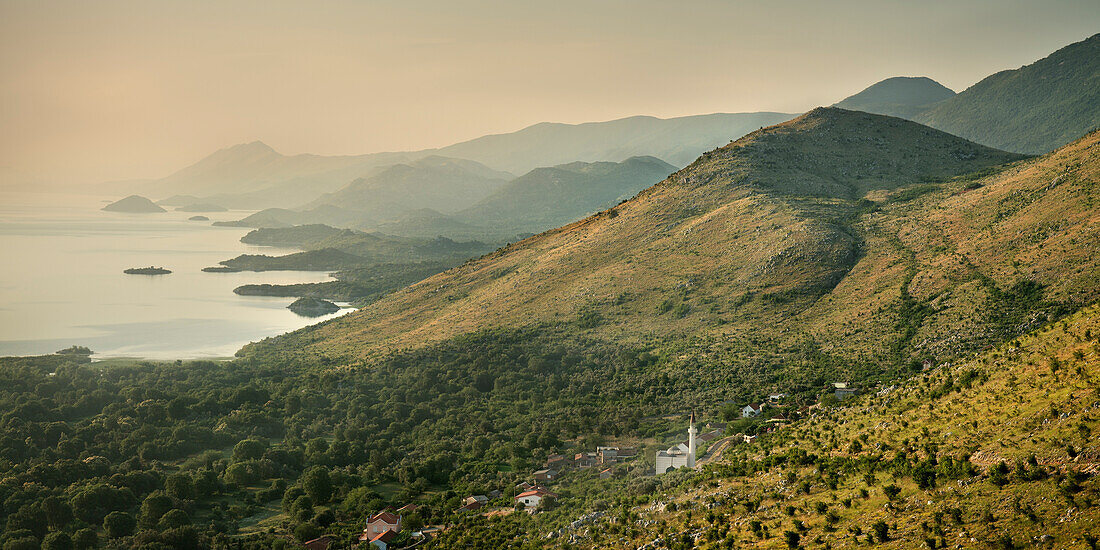 View across to Albania with mosque, mountains and fog, Murici, Lake Skadar National Park, Montenegro, Western Balkan, Europe