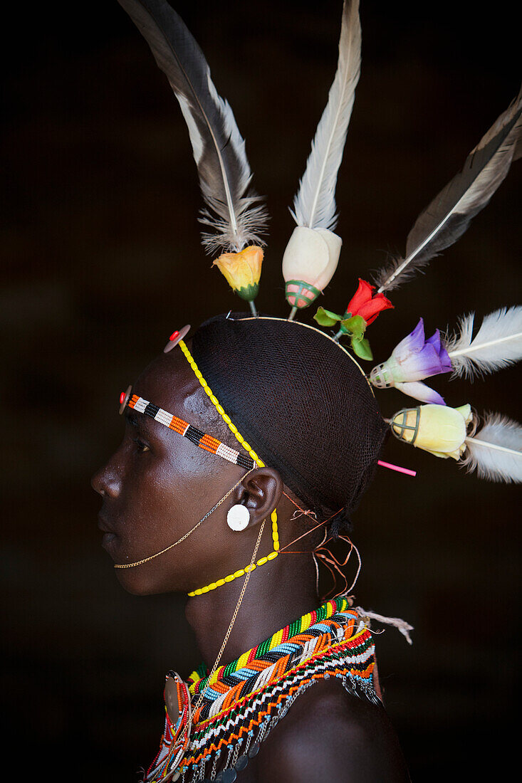 Portrait of young Samburu man in traditional dress, South Horr, Kenya