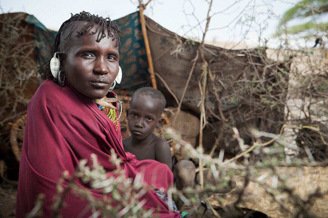 Portrait of traditionally dressed Turkana woman and child, Loyangalani, Kenya