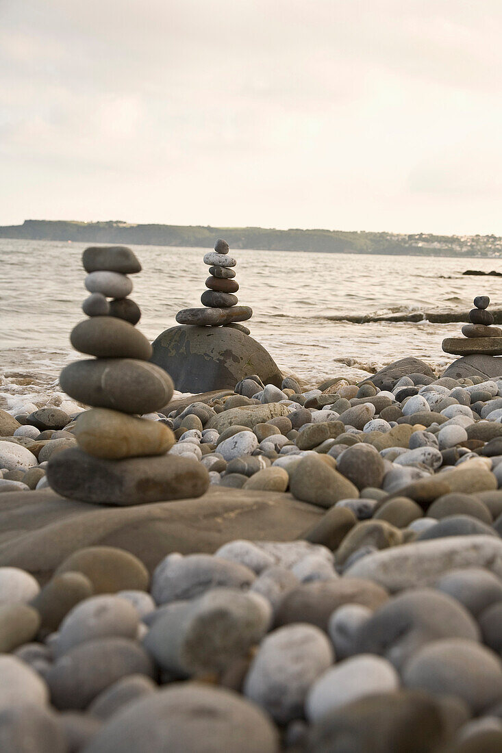 United Kingdom, Wales, Pembrokeshire, Stacked pebbles on beach, Amroth