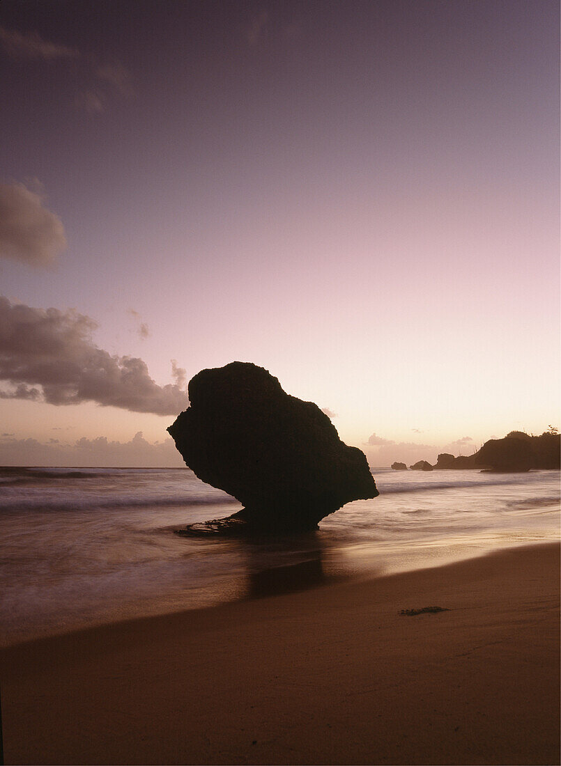 Silhouette of strange shaped rock at dawn, Bathsheba, Barbados