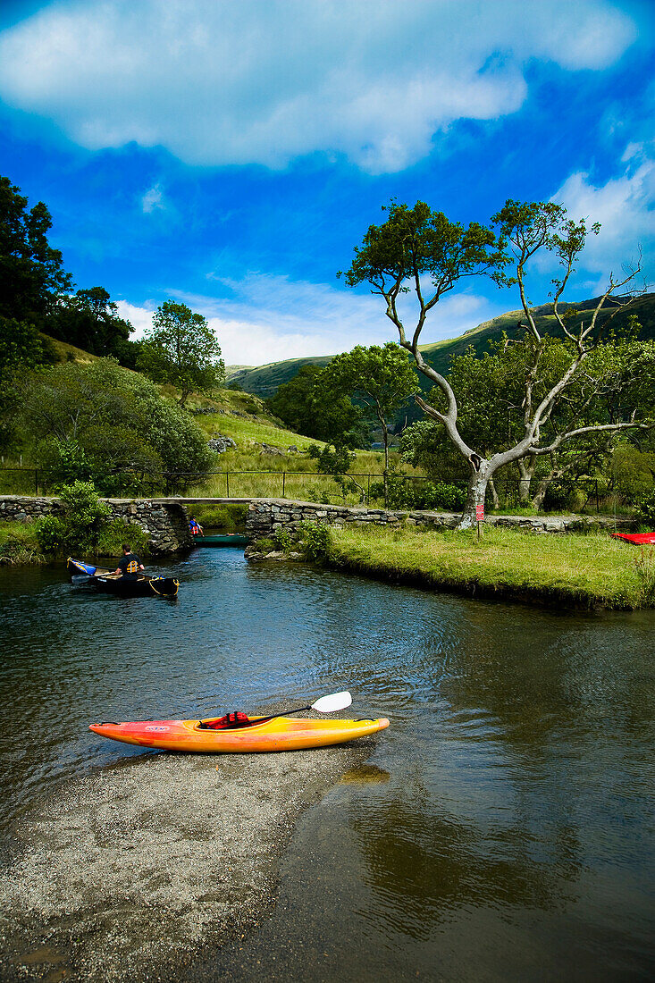 Canoeing at river near Llyn Gwynant Campsite, Nant Ggwynant, Snowdonia National Park, North Wales, Wales, UK