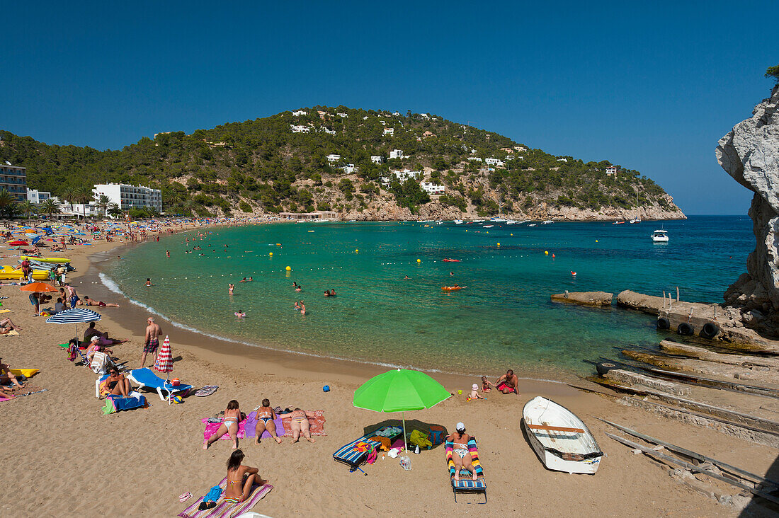 People relaxing at beach, Cala de San Vicente, Ibiza, Spain