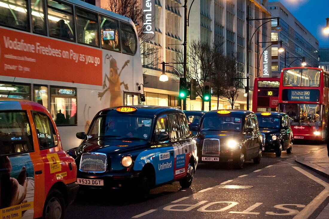 Traffic on Oxford Street at dusk, London UK