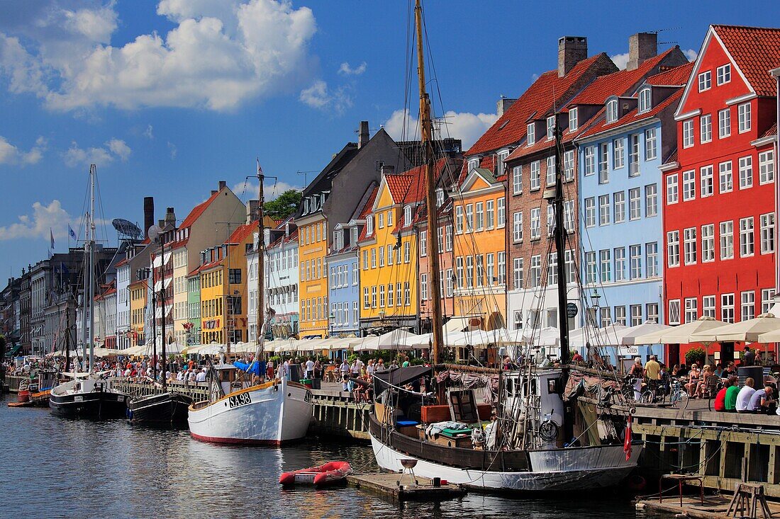 Nyhavn is a colourful 17th century waterfront, canal and popular entertainment district in Copenhagen, Denmark  Stretching from Kongens Nytorv to the harbourfront just south of the Royal Playhouse, it is lined by brightly coloured 17th and early 18th cent