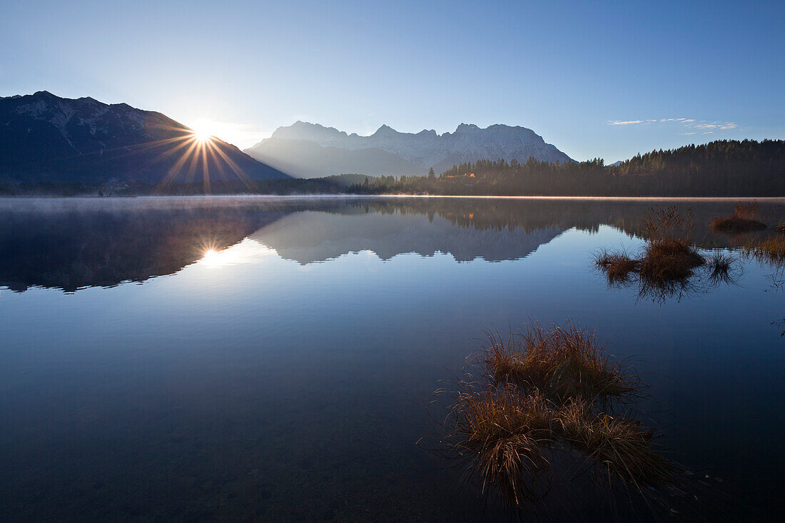 Sunrise, view over lake Barmsee to the Soiern mountains and Karwendel mountains, near Mittenwald, Bavaria, Germany