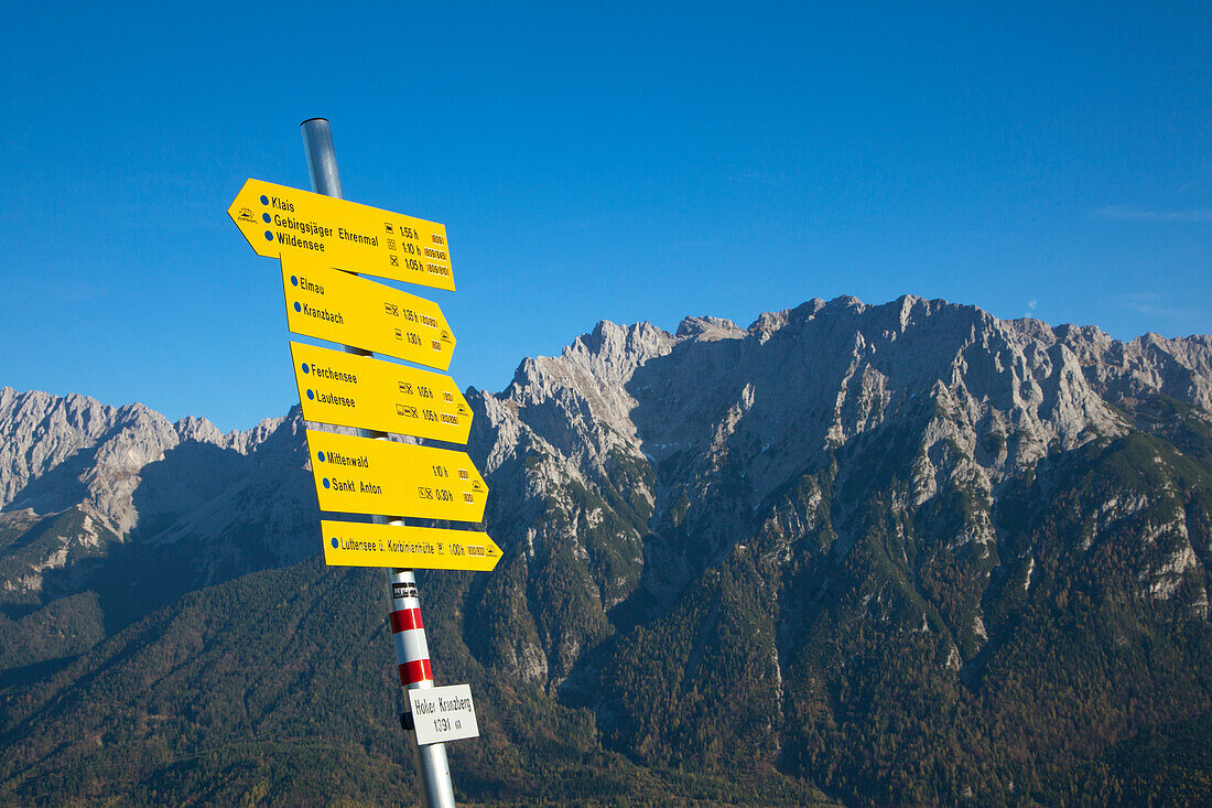 Sign post at Hoher Kranzberg, view to the Karwendel mountains, near Mittenwald, Bavaria, Germany