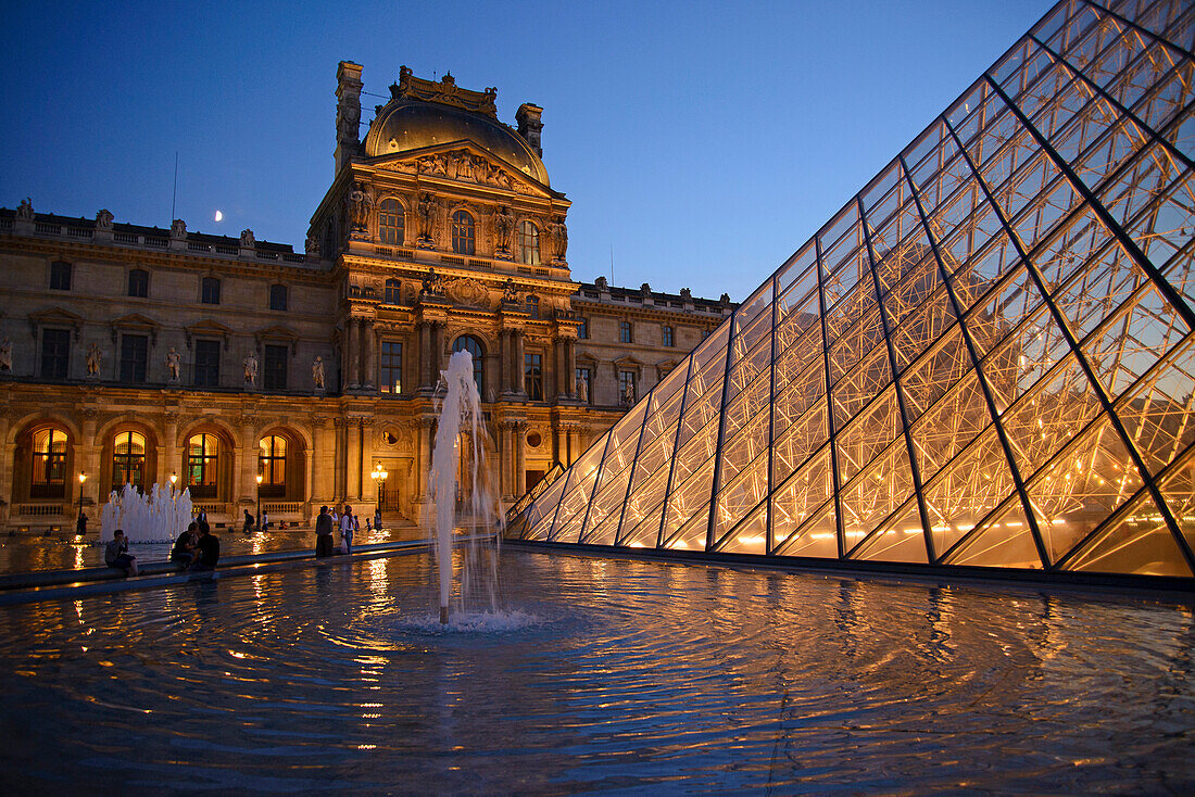 Louvre at night with pyramid, Paris, France, Europe
