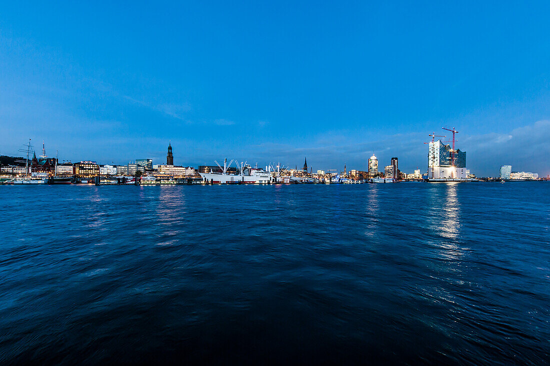 View ove river Elbe to Hafencity with Elbe Philharmonic Hall in the evening, Hamburg, Germany