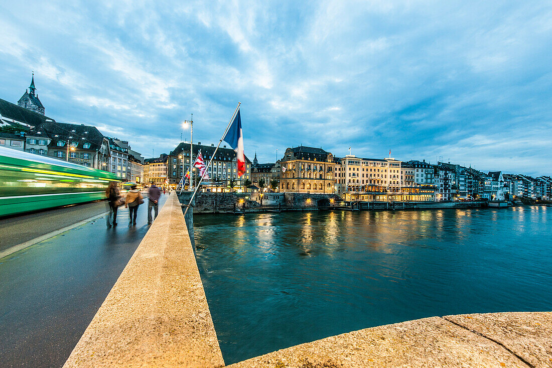 View over the river Rhine with Mittlere Bruecke (Middle Bridge) to a hotel in the evening, Basel, Canton of Basel-Stadt, Switzerland