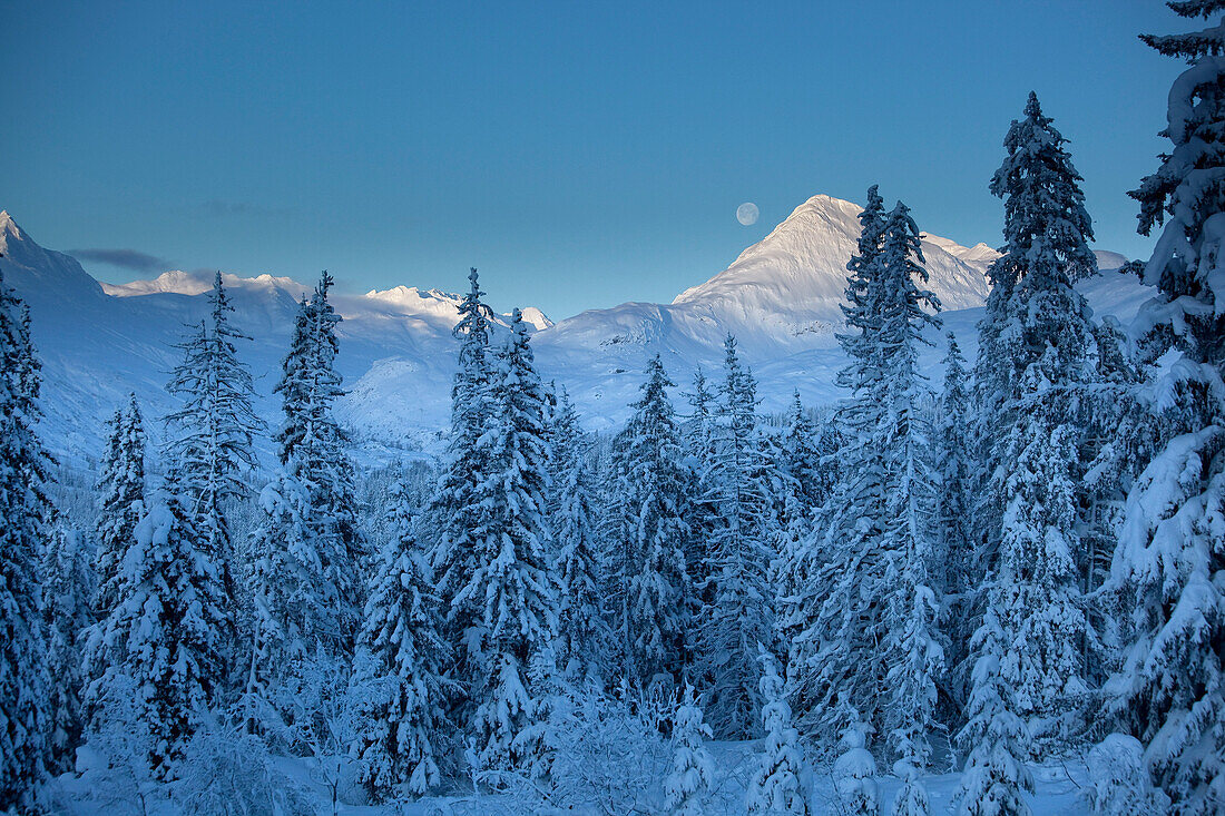 Moon setting over Mount McDonell near Haines, Alaska