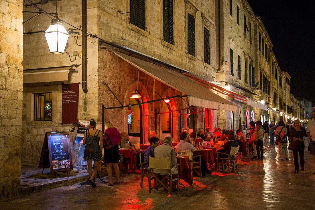 People sitting outside a restaurant in the old town Placa at night, Dubrovnik, Dubrovnik-Neretva, Croatia