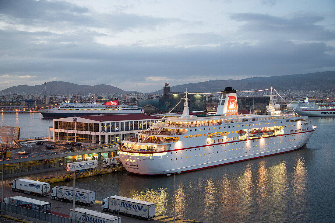 Trucks with provisions and cruise ship MS Deutschland at dusk, Reederei Peter Deilmann at the pier, Piraeus, Attica, Greece