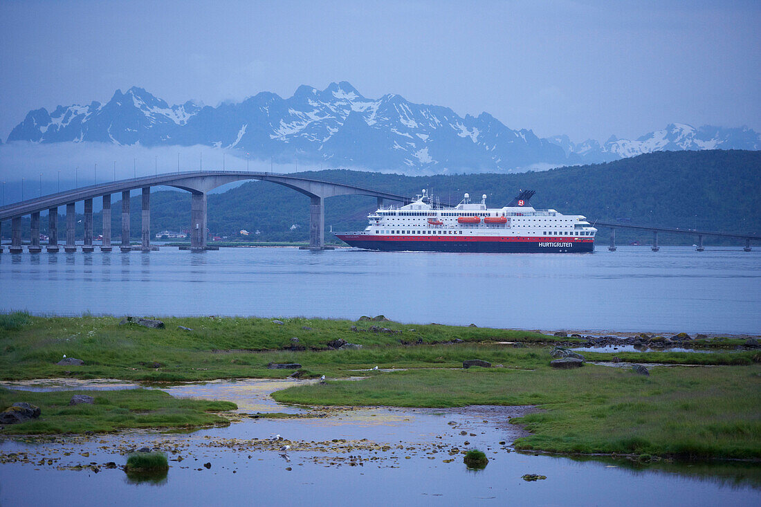 MS, Nordkapp, of the Hurtigruten under the bridge across the Langoysundet, Hadseloya, Vesteralen, Province of Nordland, Nordland, Norway, Europe