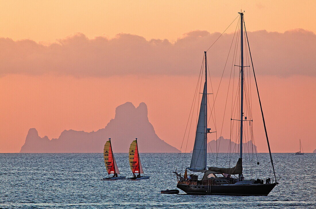 Sunset at Platja de ses Illetes and the rock Cala d'Hort of Ibiza, Formentera, Balearic Islands, Spain