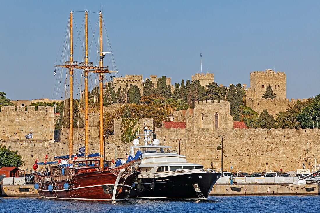 Ships in Emborio harbour and the walls of the old town, Rhodes town, Rhodes, Dodecanese, South Aegean, Greece