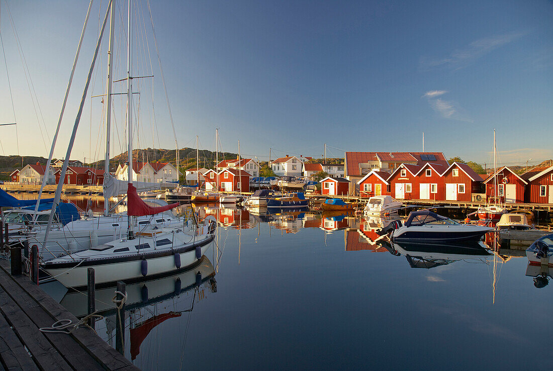 Boats and boot houses in Bleket port, Tjoern Island, Province of Bohuslaen, West coast, Sweden, Europe