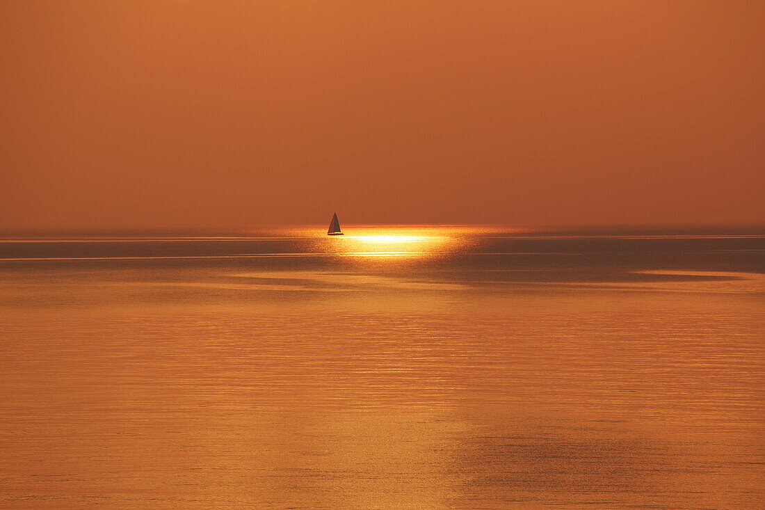 Sailing boat at sunset, Baltic sea coast, Mecklenburg-Vorpomerania, Germany