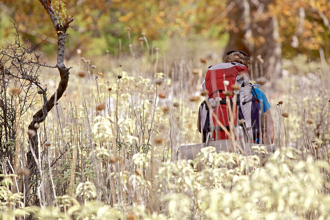 Woman hiking along long-distance footpath Lycian Way, Antalya, Turkey