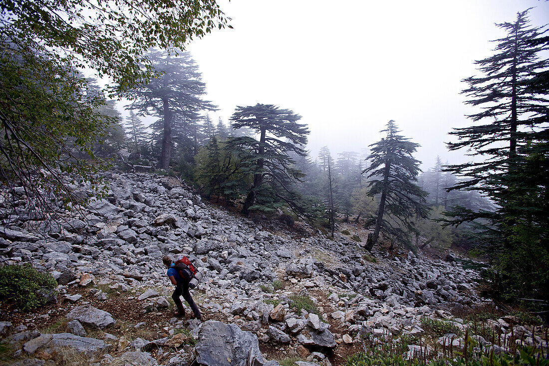 Woman hiking along long-distance footpath Lycian Way, Antalya, Turkey