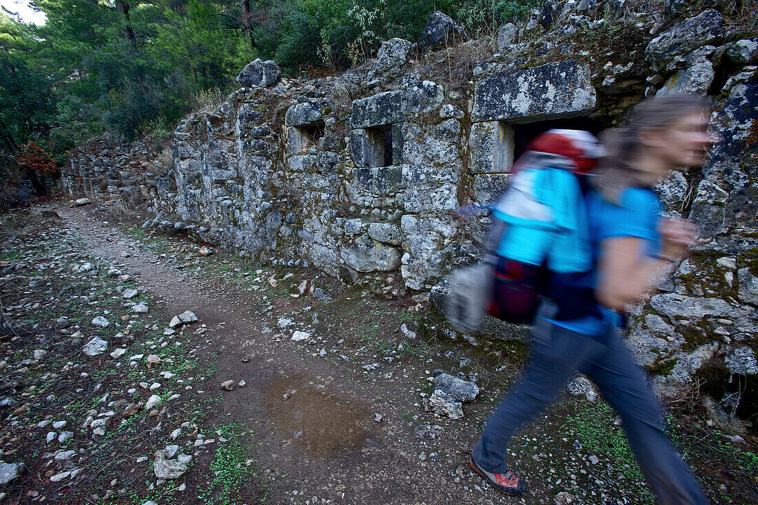 Woman hiking along long-distance footpath Lycian Way, Antalya, Turkey