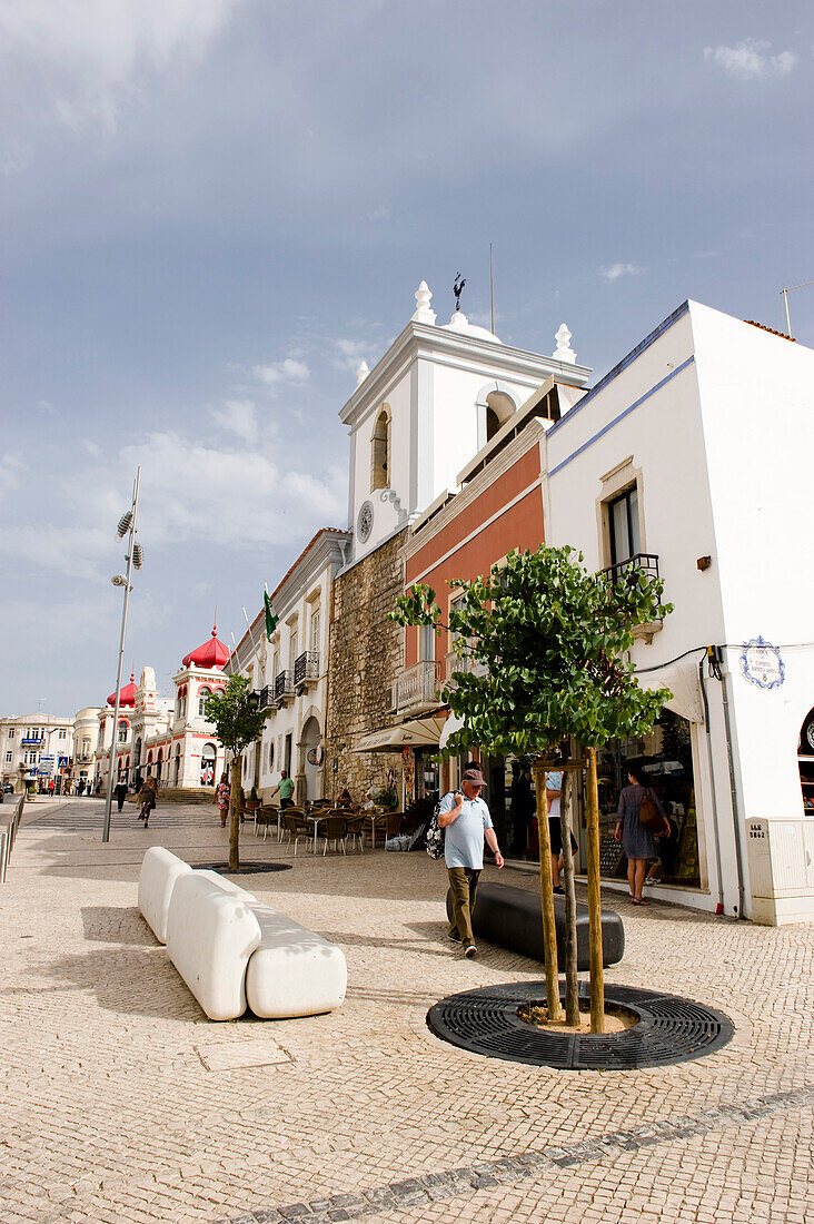 View along a street with Market Hall in background, Loule, Algarve, Portugal